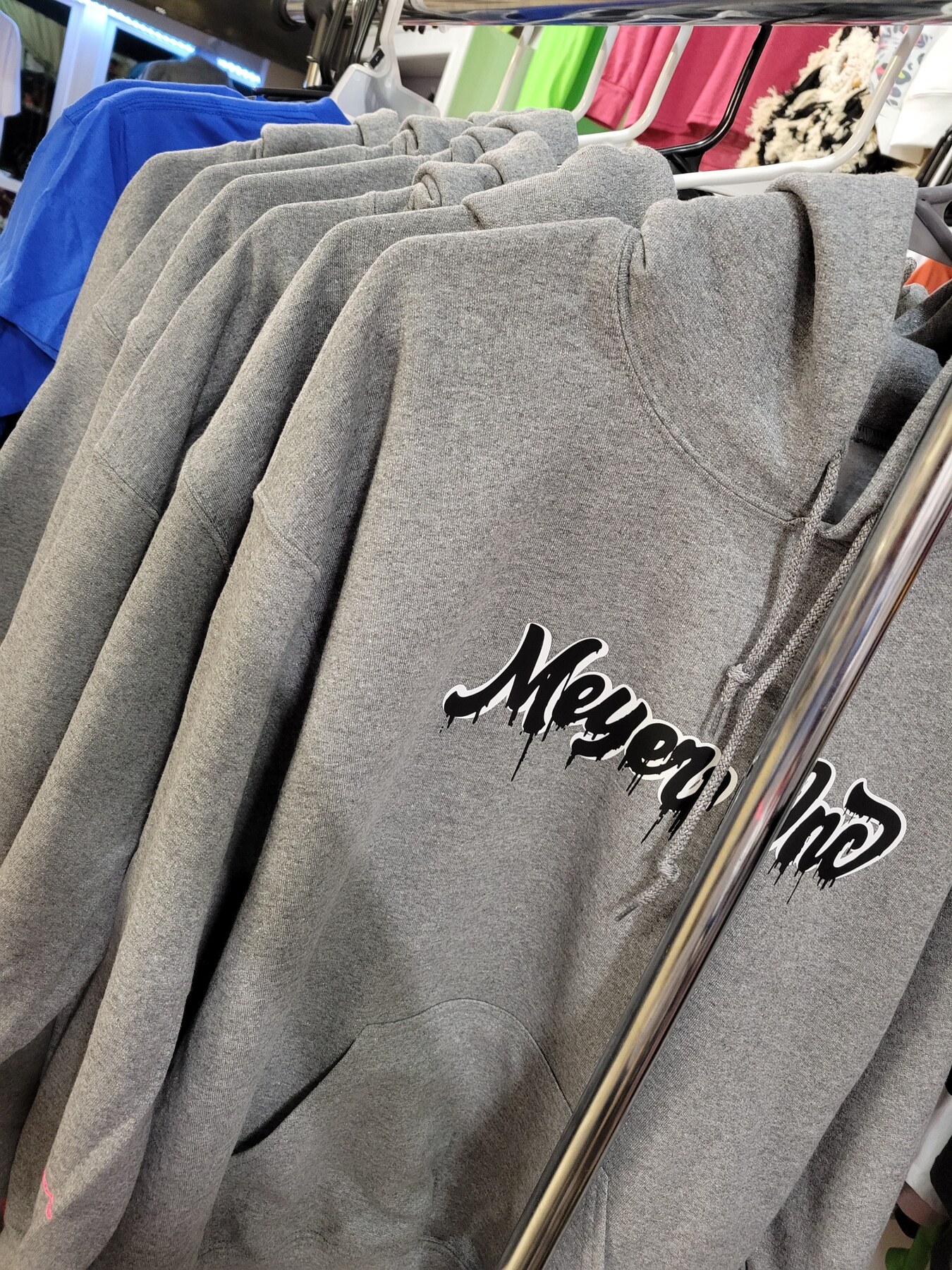 Meyer Inc. customer hoodies on a rack